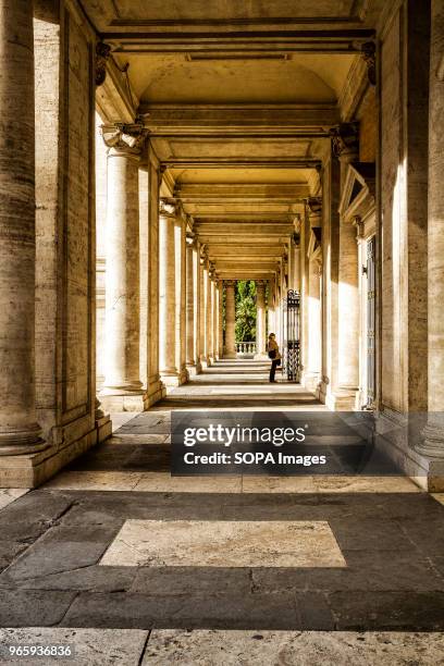 Lady seen standing at the entrance of Palazzo Nuovo. One of the buildings of the Capitoline Museums .