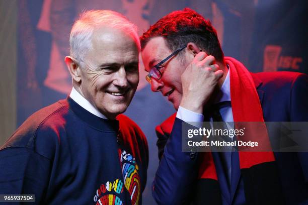 Prime Minister Malcom Turnbull talks with Victorian Premier Daniel Andrews during The Long Walk before during the round 11 AFL match between the...