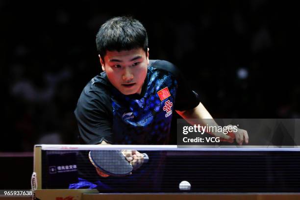 Liang Jingkun of China competes in the Men's Singles quarter-final match against Ma Long of China during day three of the 2018 ITTF World Tour China...