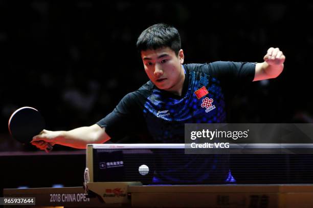 Liang Jingkun of China competes in the Men's Singles quarter-final match against Ma Long of China during day three of the 2018 ITTF World Tour China...