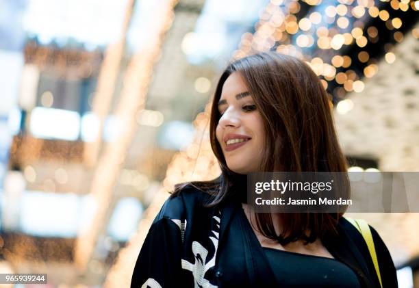 middle eastern young woman in shopping - arab shopping stock pictures, royalty-free photos & images