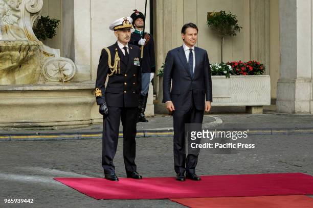 Newly appointed Italys Prime Minister Giuseppe Conte reviews a guard of honor upon his arrival at Chigi Palace for the bell ceremony.