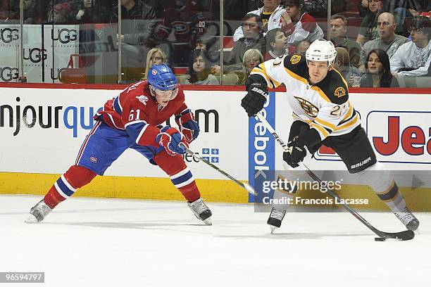 Andrew Ference of Boston Bruins takes a shot in front of Ben Maxwell of the Montreal Canadiens during the NHL game on February 7, 2010 at the Bell...