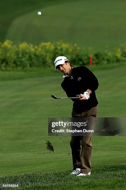 Musician Kenny G pitches to the green on the sixth hole during the first round of the AT&T Pebble Beach National Pro-Am at Pebble Beach Golf Links on...