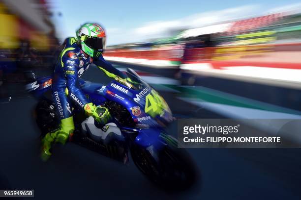 Movistar Yamaha MotoGP's Italian rider Valentino Rossi exits the pit lane during the free practice of the Moto GP of the Italian Grand Prix at the...