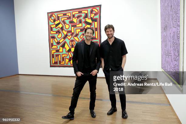 Adrien Brody and Michiel Huisman pose in the Keith Haring exhibition at Albertina on June 2, 2018 in Vienna, Austria. The visit is part of the Life...