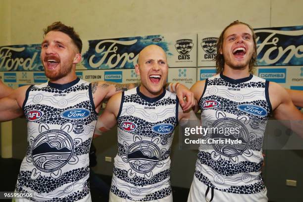 Cats sing the team song after winning the round 11 AFL match between the Gold Coast Suns and the Geelong Cats at Metricon Stadium on June 2, 2018 in...