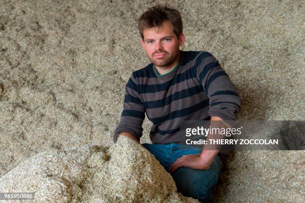 Marien Sablery, an agricultor cultivating organic hemp on 25 hectares, poses in Evaux les Bains, Creuse region, on May 31, 2018. - Emmanuel Macron...