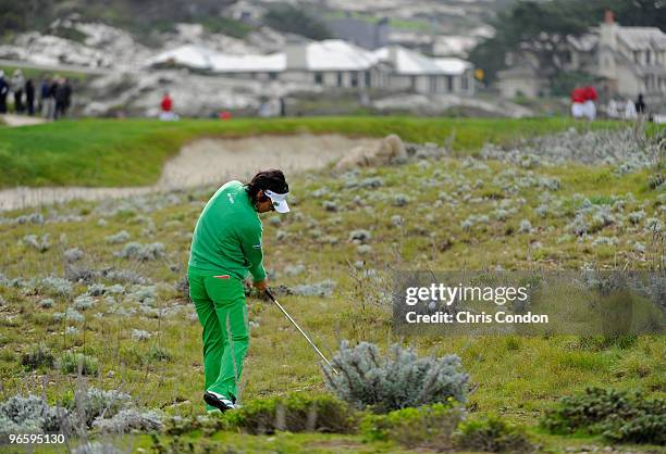 Ryo Ishikawa of Japan hits from the brush on during the first round of the AT&T Pebble Beach National Pro-Am at Monterey Peninsula Country Club on...