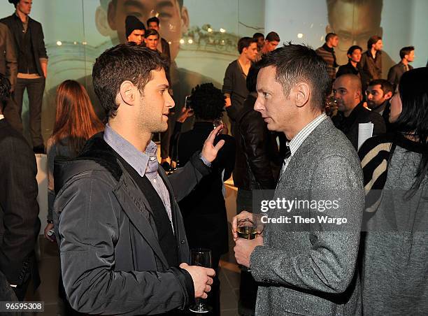 Actor Justin Bartha and editor-in-chief of GQ Jim Nelson attend the GQ's Best New Menswear Designers Party at the IAC Building on February 11, 2010...