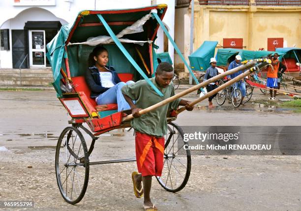 Africa, Madagascar, Toliara , the famous Rickshaw, legacy migration flows from Asia colorful rickshaws carrying people or goods.