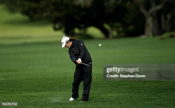 Musician Kenny G hits his third shot on the second hole during the first round of the AT&T Pebble Beach National Pro-Am at Pebble Beach Golf Links on...