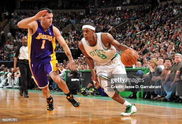 Rajon Rondo of the Boston Celtics drives the ball up court against Jordan Farmar of the Los Angeles Lakers during the game at The TD Garden on...