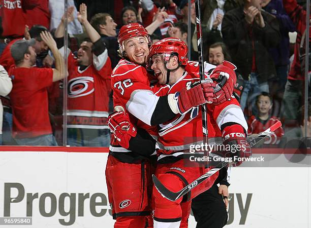 Ray Whitney of the Carolina Hurricanes celebrates his first period goal with teammate Jussi Jokinen during a NHL game against the Buffalo Sabres on...