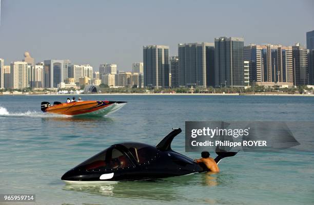 Jet ski and speed boat along Abu Dhabi, United Arab Emirates.