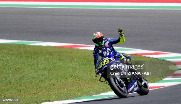 Movistar Yamaha MotoGP's Italian rider Valentino Rossi waves during the free practice of the Moto GP of the Italian Grand Prix at the Mugello track...