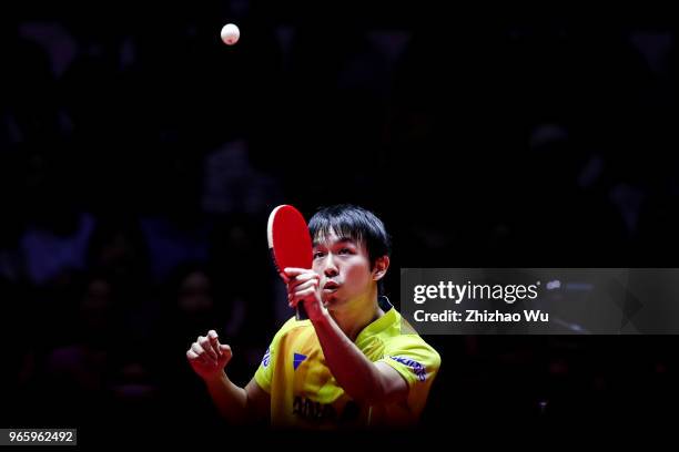 Niwa Koki of Japan in action at the men's singles quarter-final compete with Fan Zhendong of China during the 2018 ITTF World Tour China Open on June...