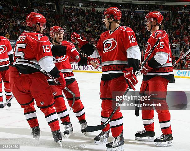 Brandon Sutter of the Carolina Hurricanes is congratulated for his first period goal by teammates Sergei Samsonov, Tuomo Ruutu, and Joni Pitkanen...