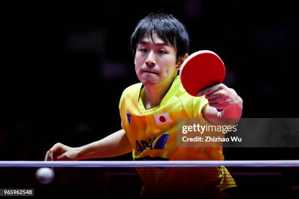 Niwa Koki of Japan in action at the men's singles quarter-final compete with Fan Zhendong of China during the 2018 ITTF World Tour China Open on June...