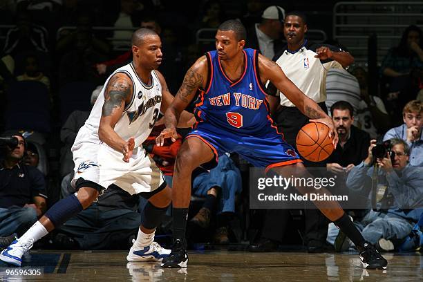 Jonathan Bender of the New York Knicks looks to make a move against Caron Butler of the Washington Wizards during the game at the Verizon Center on...