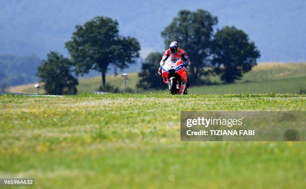 Italy's rider Andrea Dovizioso takes part in the free practice of the Moto GP of the Italian Grand Prix at the Mugello track on June 2, 2018.