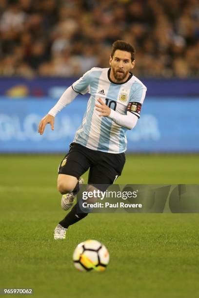 Lionel Messi of Argentina runs with the ball during the Brazil Global Tour match between Brazil and Argentina at Melbourne Cricket Ground on June 9,...