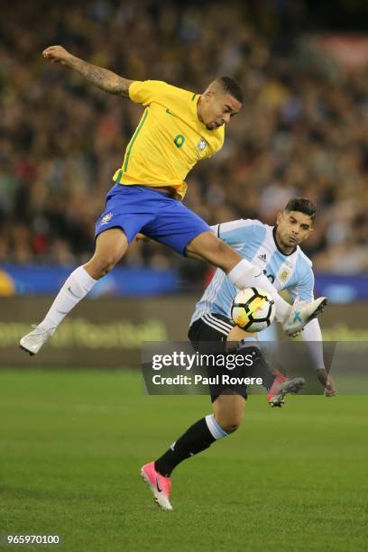 Gabriel Jesus of Brazil competes for the ball with Ever Banega of Argentina during the Brazil Global Tour match between Brazil and Argentina at...
