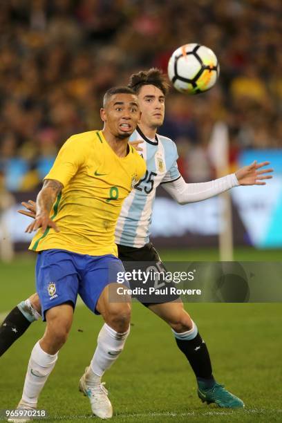 Gabriel Jesus of Brazil competes for the ball with Nicolas Tagliafico of Argentina during the Brazil Global Tour match between Brazil and Argentina...