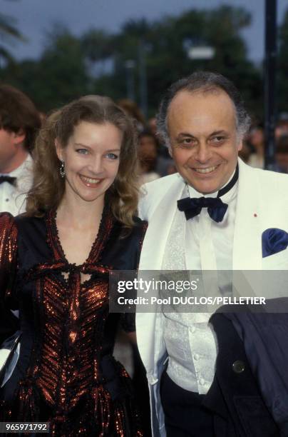 Le chef d'orchestre Lorin Maazel et son épouse l'actrice Dietlinde Turban au Festival de Cannes le 19 mai 1987 à Cannes, France.