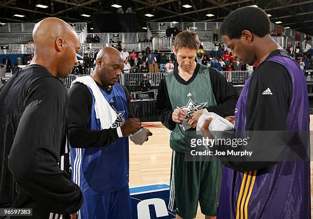 Green, Bruce Bowen, Mitch Richmond and Detlef Shrempf NBA Legends sign shirts on center court at Jam Session presented by Adidas during NBA All Star...
