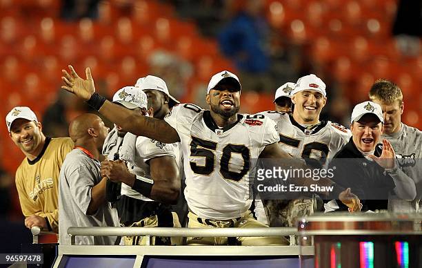 Marvin Mitchell of the New Orleans Saints and teammates celebrate after defeating the Indianapolis Colts during Super Bowl XLIV on February 7, 2010...