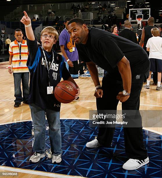 Robert Horry NBA Legend talks to a young participant in the Legends Experience hosted by Champs and Adidas on center court at Jam Session presented...