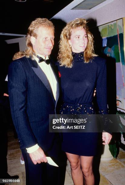 Vitas Gerulaitis et sa femme Ruta lors d'une soirée réunissant les participants du championnat de tennis Lipton International le 24 février 1987,...