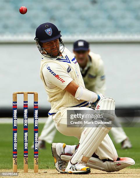 Phil Jaques of the Blues ducks under a short delivery during day one of the Sheffield Shield match between the Victorian Bushrangers and the New...
