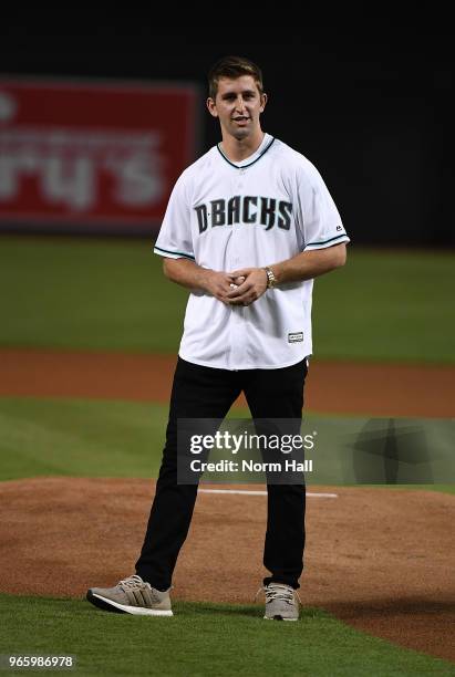 Arizona Cardinals first round draft pick Josh Rosen throws a ceremonial first pitch prior to a game between the Arizona Diamondbacks and the...