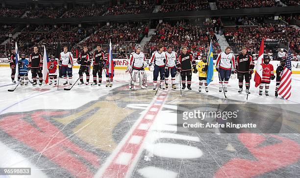 Members of of the Ottawa Senators and the Washington Capitals participating in the upcoming 2010 Winter Olympics are honoured at centre ice prior to...