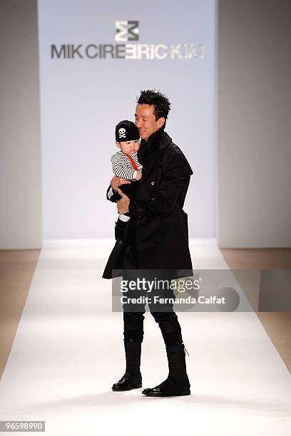 Designer Eric Kim walks the runway at the Mik Cire Fall 2010 Fashion Show during Mercedes-Benz Fashion Week at The Promenade at Bryant Park on...
