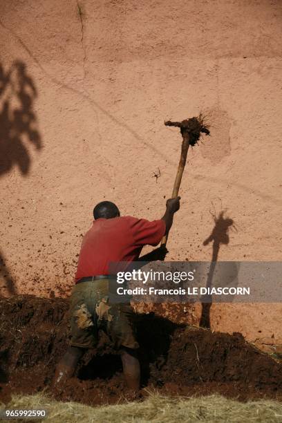 An Ethiopian manual laborer is digging a trench in the streets of Bahir Dar, near Lake Tana on April 21, 2009 in Bahir Dar, Ethiopia.