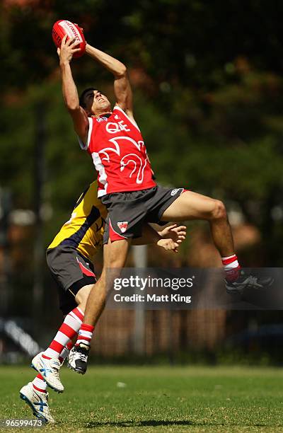 Swans players compete for a mark during a Sydney Swans intra-club AFL match at Lakeside Oval on February 12, 2010 in Sydney, Australia.