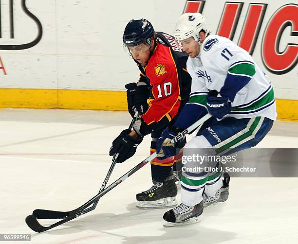 David Booth of the Florida Panthers breaks a stick while skating against Ryan Kesler of the Vancouver Canucks at the BankAtlantic Center on February...