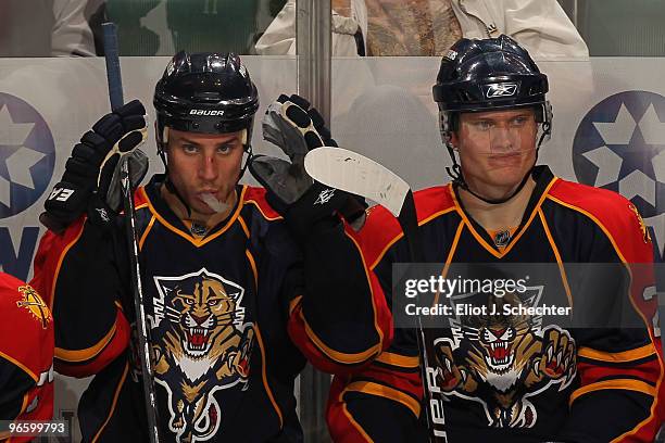 Gregory Campbell of the Florida Panthers and teammate Kamil Kreps watch the action from the bench against the Vancouver Canucks at the BankAtlantic...