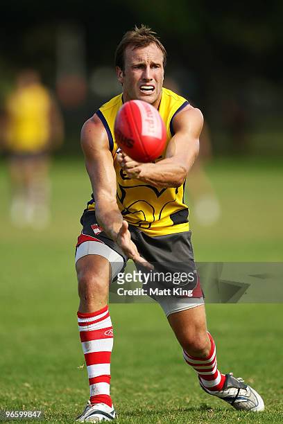 Jude Bolton of the Swans passes the ball during a Sydney Swans intra-club AFL match at Lakeside Oval on February 12, 2010 in Sydney, Australia.