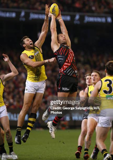 Toby Nankervis of the Tigers battles with Tom Bellchambers of the Bombers during the round 11 AFL match between the Essendon Bombers and the Richmond...