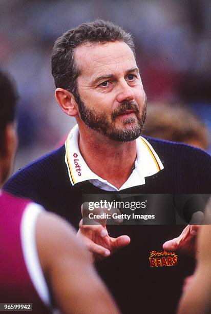 Brisbane coach Robert Walls addresses his players at quarter time during a AFL match in Melbourne, Australia.