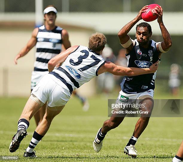 Travis Varcoe of Geelong is tackled during a Geelong Cats intra-club AFL match at Gipps Road Park on February 12, 2010 in Sydney, Australia.