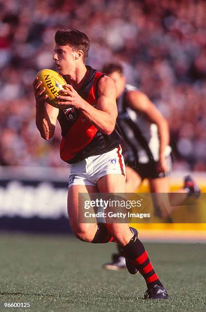 Matthew Lloyd of the Bombers catches the ball during the round five AFL match between the Essendon Bombers and the Collingwood Magpies at the MCG in...