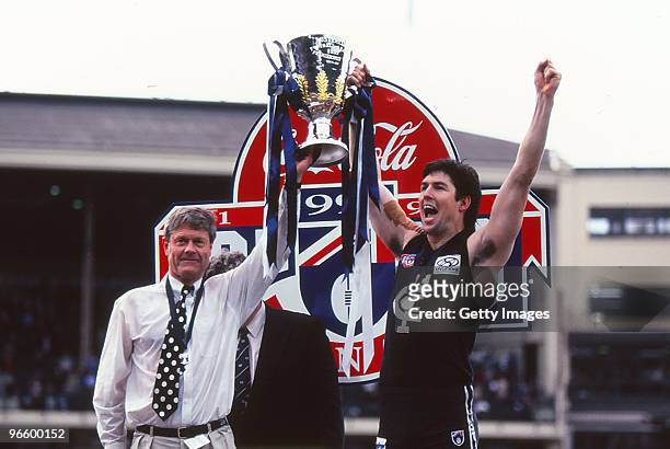 David Parkin and Stephen Kernahan of the Carlton Blues hold aloft the premiership trophy after winning the 1995 AFL Grand Final match between Carlton...