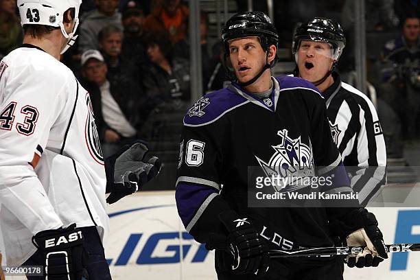 Rich Clune of the Los Angeles Kings and Jason Strudwick of the Edmonton Oilers converse during their game on February 11, 2010 at Staples Center in...