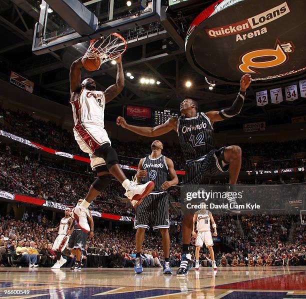 Shaquille O'Neal of the Cleveland Cavaliers dunks the ball against Dwight Howard of the Orlando Magic on February 11, 2010 at The Quicken Loans Arena...