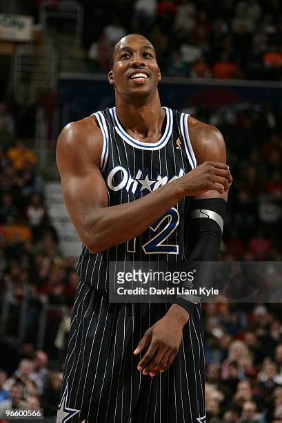 Dwight Howard of the Orlando Magic smiles as he steps up to the free throw line in the fourth quarter against the Cleveland Cavaliers on February 11,...